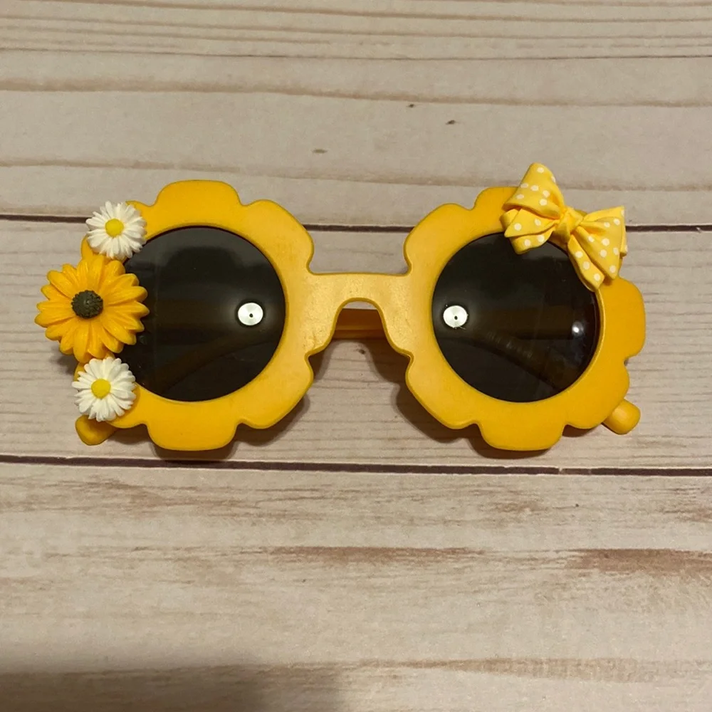Girls yellow flower shaped sunglasses